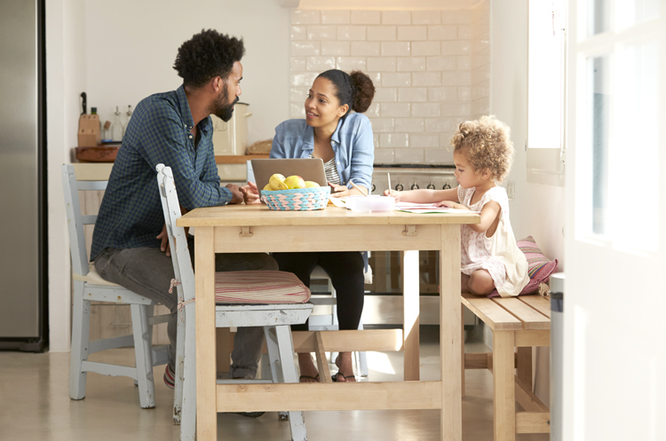 Family at a dining table in a kitchen