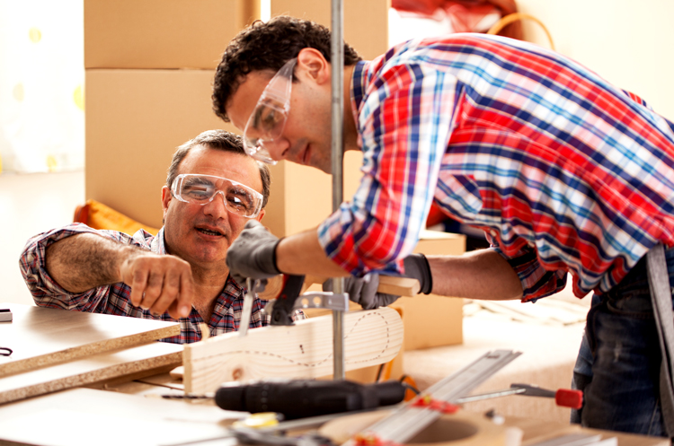 Father and son working on a carpentry project 