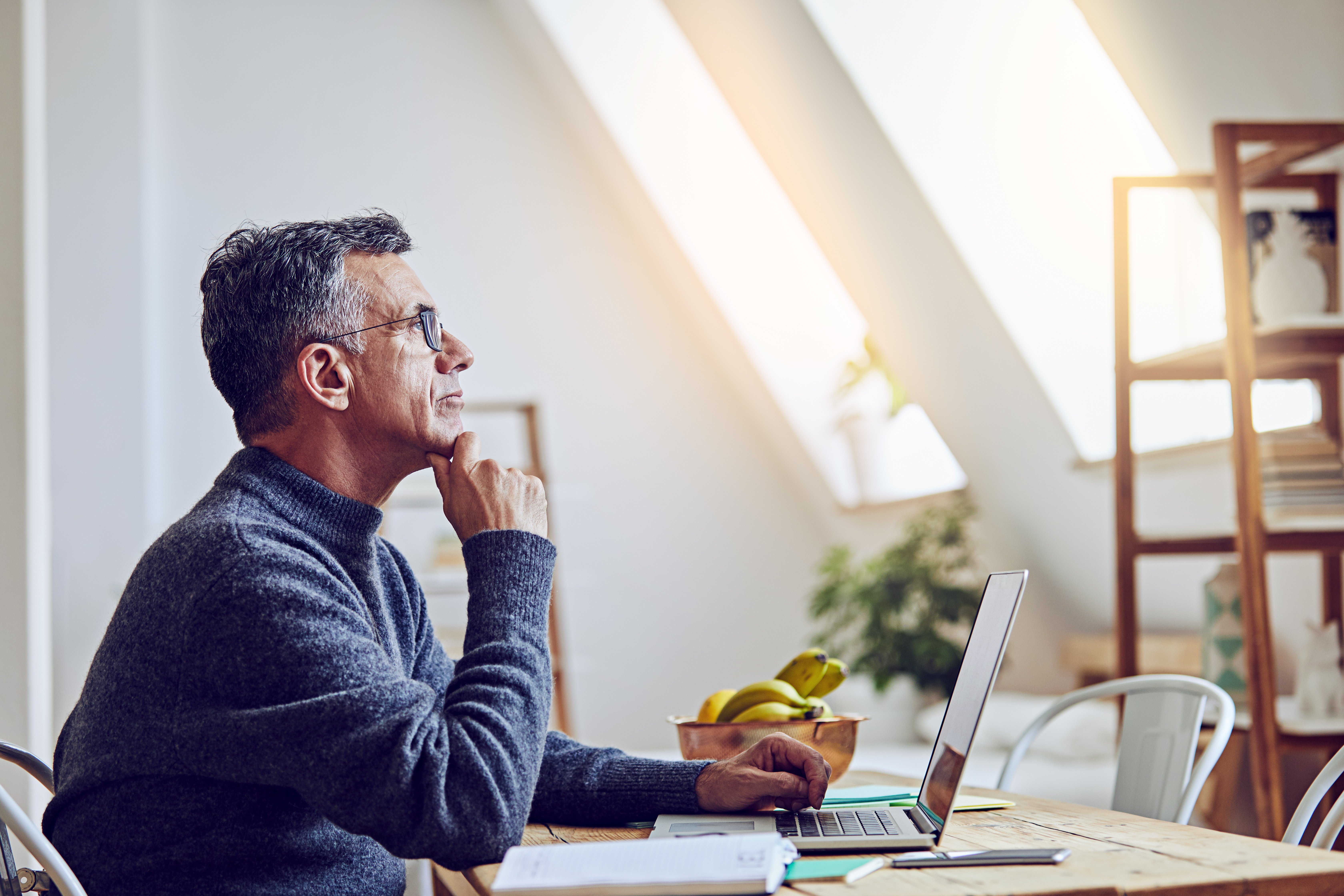 Man using a laptop at home