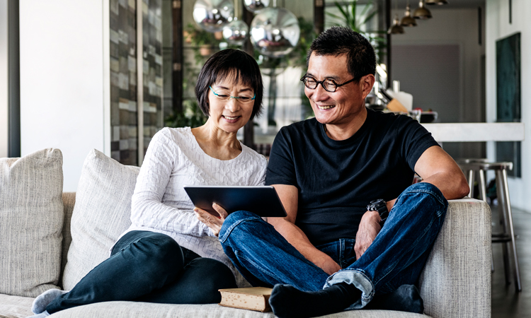 Two people looking at a mobile device