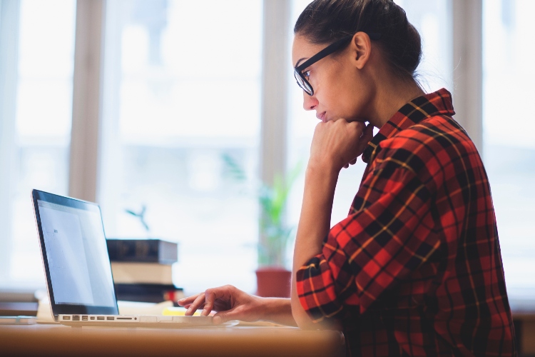 Woman working on laptop computer